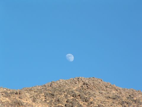 1994 Jeep YJ - A daytime moon hangs in the sky above a desert landscape, with a SuperMotors logo visible at the bottom right.