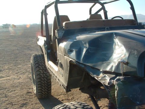 1994 Jeep YJ - This 1994 Jeep YJ has significant damage to its front fender and hood.