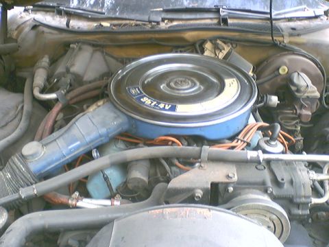 1973 Ford Ranchero - Close-up of a vehicle's engine bay, the air cleaner assembly with "351-4V" markings.