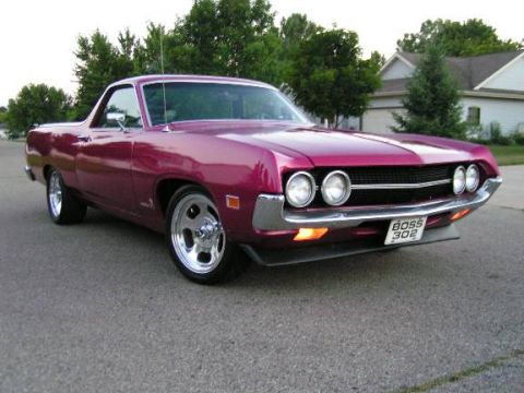 1973 Ford Ranchero - A purple 1970 Ford Ranchero is parked on a suburban street.