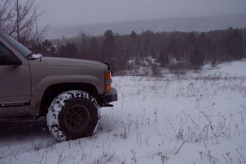 2000 Chevrolet Tahoe - Chevrolet Tahoe parked in a snowy landscape during winter.