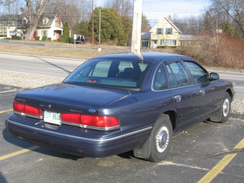 1991 Ford LTD Crown Victoria - This 1991 Ford Crown Victoria LTD sedan is seen from the rear in a parking lot.