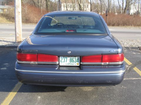 1991 Ford LTD Crown Victoria - Rear view of a 1991 Ford Crown Victoria LTD, showing its distinctive taillights and license plate.
