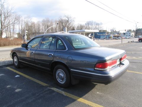 1991 Ford LTD Crown Victoria - This sedan has a distinctive body style that suggests a model year around 1992, not 1991.