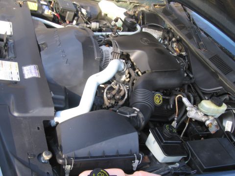 1991 Ford LTD Crown Victoria - Close-up view of the engine bay, showing various components and hoses.