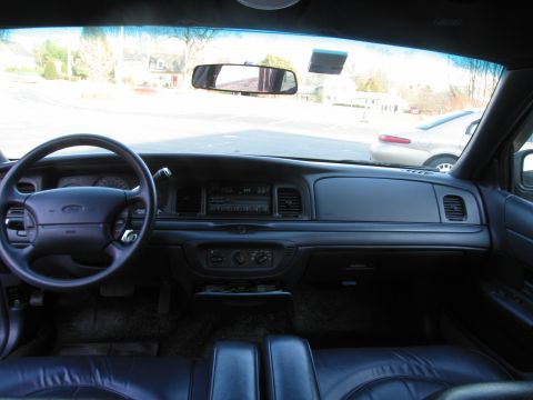 1991 Ford LTD Crown Victoria - The interior of a Ford Crown Victoria is shown, with a view of the dashboard and seats.