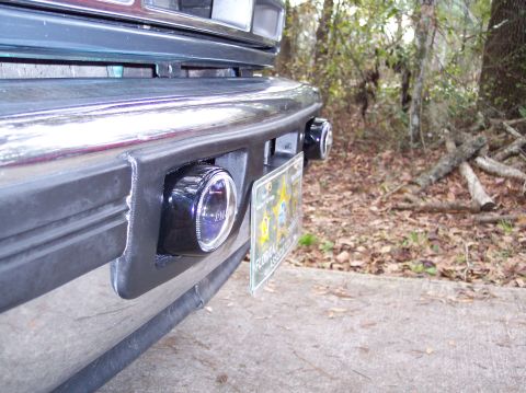 1996 Ford Bronco - Pilot fog lights that I got for X-mas from my daughter. They're mounted with...now get this...sticky back industrial-strength velcro