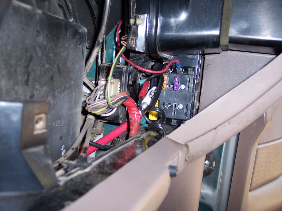 Here is the auxilliary fuse panel I mounted behind the glove compartment. It has 6 circuits and each one is rated to 30 amps. Right now it is being used to power the CB and some extra 12V outlets with plenty of room for future accessories