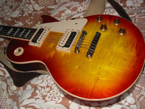 1989 Mazda MX-6 - Electric guitar with a sunburst finish and chrome hardware is shown close-up.
