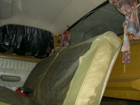 1967 Ford Ranchero - Interior view of a vehicle's passenger side, with a mattress and window coverings visible.