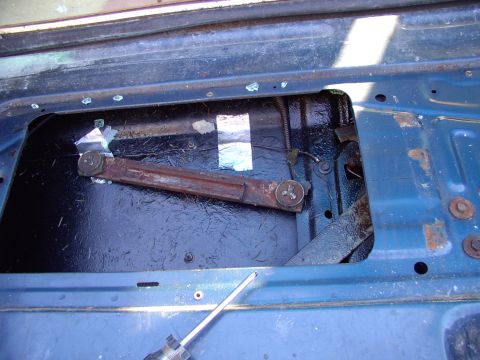 1986 Ford Bronco - I'd show you the old glass but it blew up and shattered. Note one of the slider rails that bolts to the glass and allows the glass to raise.