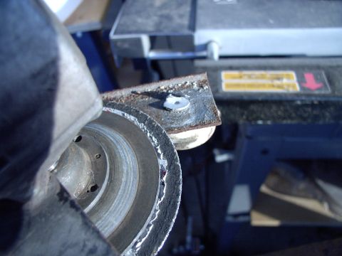 1986 Ford Bronco - The grinder makes short work of removing the non-splayed side.