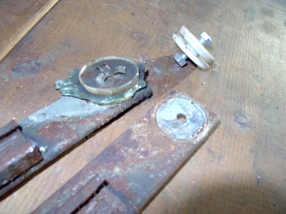 There's one still on the plate and the other ground off the plate. Didn't take long to figure out a regular 1/4 UNC-20 bolt, with washers will do the job nicely. One inch long was just about perfect.