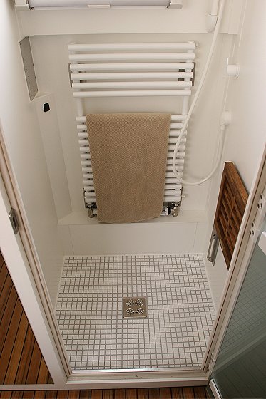 1993 Ford Bronco - Interior view of a shower stall, showing a towel rack and tiled floor.