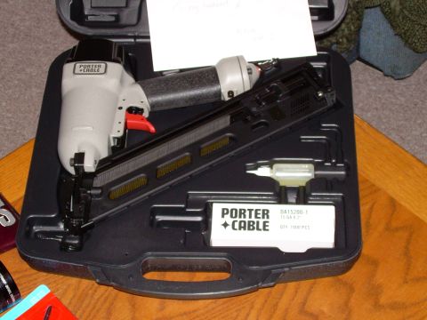 1966 Land Rover Discovery - A Porter Cable nail gun is shown inside its carrying case, alongside a box of nails.