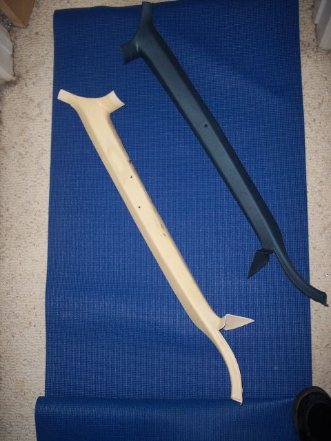 1972 Ford Ranchero - Two automotive interior trim pieces are shown on a blue mat, possibly for restoration or replacement.