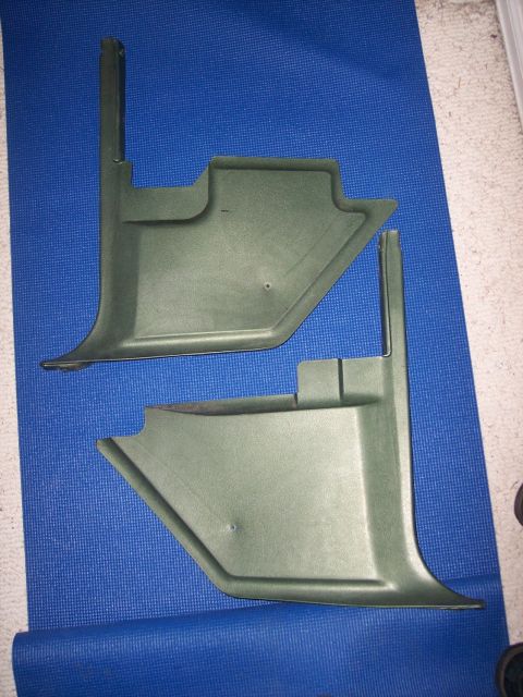 1972 Ford Ranchero - Two green plastic interior trim pieces are laid out on a blue mat.