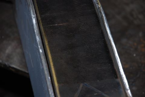 1996 Ford Bronco - A close-up view of a fabricated metal section, likely a component for a vehicle's rear bumper build.