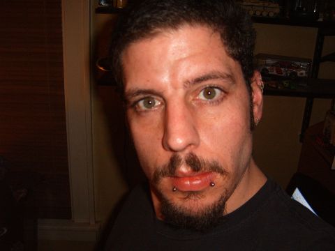 1993 Ford Bronco - A man with facial piercings is shown in a close-up shot.