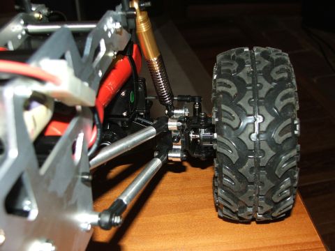 1996 Ford Bronco - The intricate suspension system and aggressive tire tread of a remote-controlled vehicle are visible.