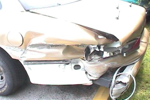 2001 Ford Mustang - This vehicle has sustained significant damage to its rear end, affecting the quarter panel and bumper.