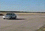 2001 Mercury Grand Marquis - A sedan is seen driving on a dirt road, creating a dust trail.