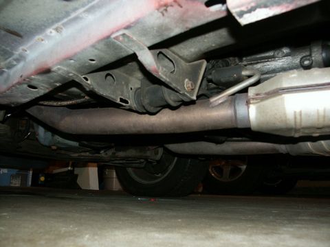 1990 Ford Mustang - Underbody view of a car, showing exhaust and suspension parts. No specific year or model is identifiable.