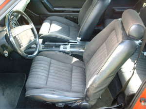 1990 Ford Mustang - The interior of a car, showing the front seats and dashboard. A watermark is visible.
