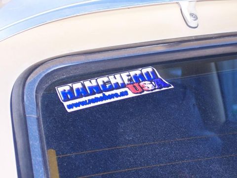 1973 Ford Ranchero - A sticker reading 'Ranchero USA' is affixed to the rear window of a vehicle.