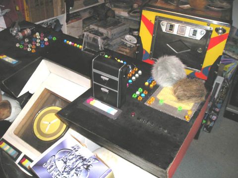 1966 Pontiac Fiero - A collection of buttons and controls are arranged on a black console, resembling a science fiction interface.