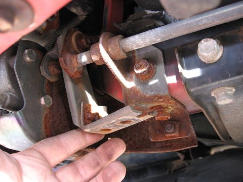 1991 Mitsubishi 3000GT - Close-up view of a corroded vehicle component, showing significant rust on metal parts.