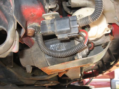 1991 Mitsubishi 3000GT - Close-up of a black engine component showing part numbers and specifications.