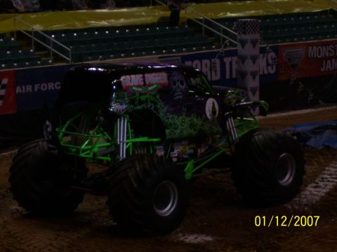 1993 Ford Bronco - The iconic Grave Digger monster truck is seen here in a stadium setting.
