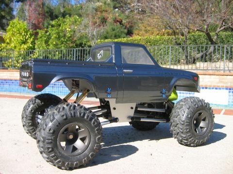 1985 Ford Bronco - This RC truck body, labeled "FORD", is mounted on a custom chassis with oversized tires.
