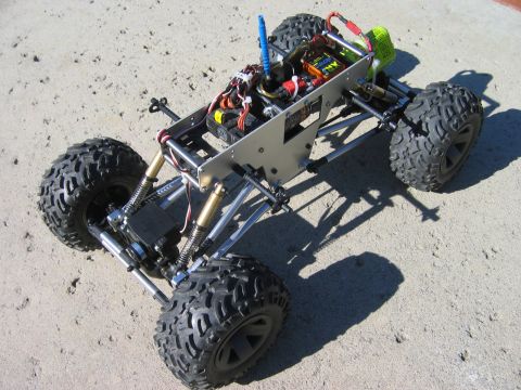 1985 Ford Bronco - This is a custom-built remote control rock crawler chassis with visible wiring and suspension components.