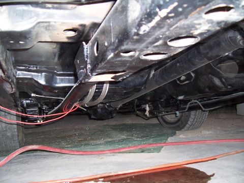 1979 Chevrolet Camaro - Underside view of a car's frame, showing brake lines and driveshaft.