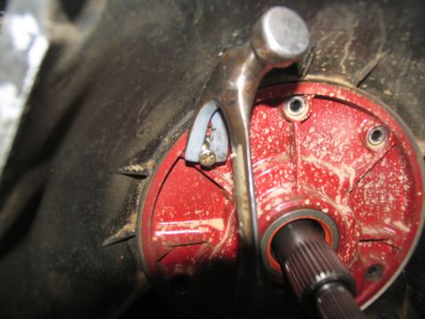 1978 Ford Bronco - Close-up of a transmission component, showing a splined shaft and a hammer.