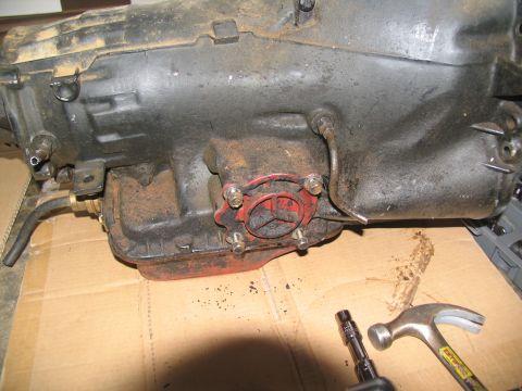 1978 Ford Bronco - Close-up view of a transmission part, possibly during a tear-down process.