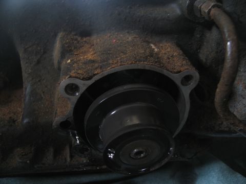 1978 Ford Bronco - Close-up view of a transmission component, showing signs of rust and wear.