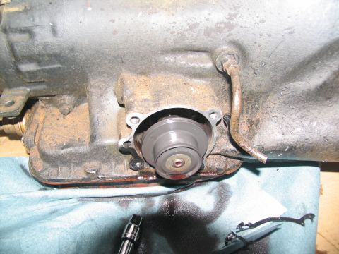 1978 Ford Bronco - Transmission disassembly reveals internal components and fluid.