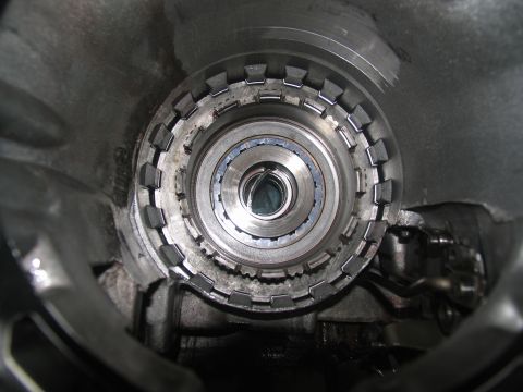 1978 Ford Bronco - A transmission clutch pack shows significant damage, with bent metal components visible.