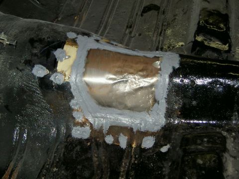 1967 Ford Ranchero - Car floor pan repair with a metal patch and filler.