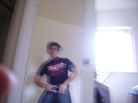 1989 Ford Bronco - A person stands in a room with a bright window, their image slightly blurred.
