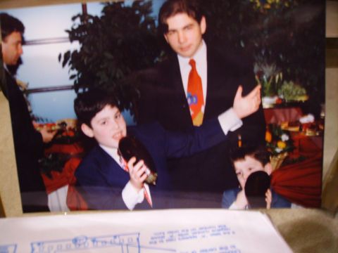 1989 Ford Bronco - A formal event with people dressed in suits, including two young boys.