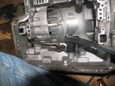 1978 Ford Bronco - Transmission internals being worked on with a wrench.