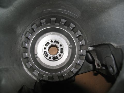 1978 Ford Bronco - Close-up view of a transmission torque converter, showing its internal splines and mounting bolt pattern.
