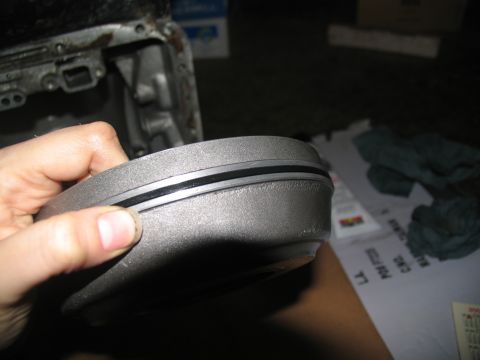 1978 Ford Bronco - Close-up of a transmission component, likely a cover or housing, with a rubber gasket in place.
