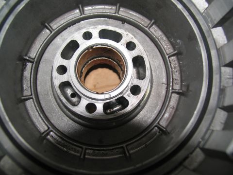1978 Ford Bronco - This image shows a close-up view of a transmission component, with some text cast into the metal.
