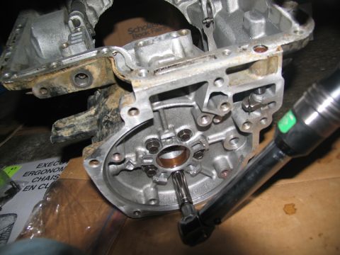 1978 Ford Bronco - Torque wrench being used on an engine part, possibly during a transmission rebuild.