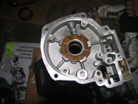 1978 Ford Bronco - A disassembled transmission housing reveals internal components, including a clutch pack, with some text visible on a box in the background.